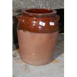 A part glazed terracotta urn, 16" high x 10 1/2" diameter.