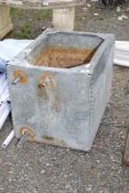 A riveted galvanised water trough, 24'' x 18 x 20" high.