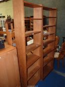 A light Oak set of floor stsading Bookshelves, two fixed and three adjustable,