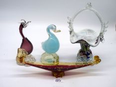 Four pieces of glass including glass bird in amethyst and duck in pale blue,