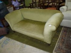 A circa 1900 drop-end Chesterfield Settee standing on turned legs and upholstered in green draylon.