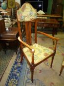 A Maple and other woods high back open armed Elbow Chair of art nouveau design having boxwood