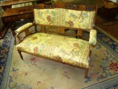 A lightwood strung Rosewood framed Edwardian double Seat having intricate fretwork and inlaid