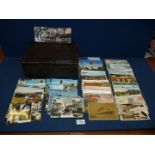 A wooden box of 150 stamped Postcards from Europe, USA and the UK, many pre-1970's.