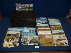 A wooden box of 150 stamped Postcards from Europe, USA and the UK, many pre-1970's.