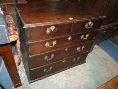 A dark Mahogany Chest of three long and two short Drawers having elaborate cast brass pierced work