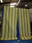 A pair of green striped curtains with deep pink satin lining, each piece 64'' wide x 58'' drop.