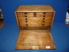 A vintage Oak workman's chest having internal drawers, with key, 17" x 8 1/2" x 11".