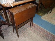 A Satinwood Sutherland Table having swept square legs,
