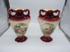 A pair of Stafford vases with classical romantic scenes, some crazing.