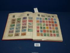 A red Strand stamp album: world collection (mainly 1925 -1955), limited picking,