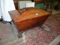 A 19th century Mahogany wine cooler of sarcophagus shape,