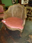 A charming serpentine fronted giltwood framed child's armchair having covered seat and backrest