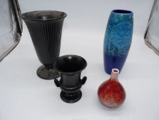 Four vases including Wedgwood and Alan Clarke designs.