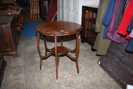 An Edwardian Mahogany occasional Table with pie crust edge, standing on six shaped legs,