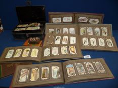 Five Cigarette card albums and a quantity of loose cigarette cards including Dogs, Aircraft,