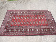 A traditional Rawalpindi woollen rug made in Pakistan, approx. 5' x 3'.