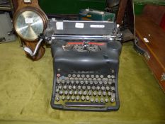 An Olivetti M44 black typewriter.