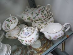 A Wedgwood 'Wild Strawberry' tea service for six with teapot, milk jug and sugar bowl.