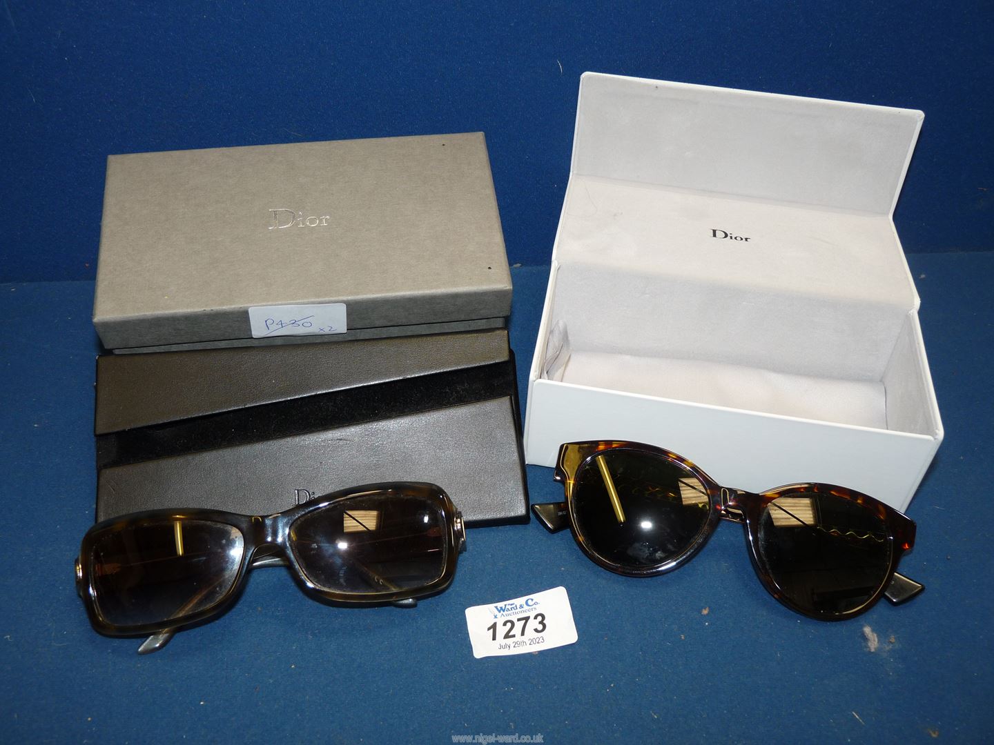 Two pairs of Christian Dior sunglasses (pre-worn) both cased and one with Dior box.