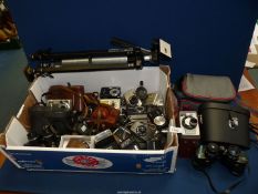 A quantity of cameras, cases and tripod including Kodak Easyshare, Kodak Brownie movie camera,