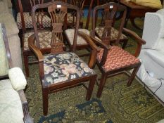 A pair of Georgian design Mahogany open-armed Elbow Chairs standing on square legs,