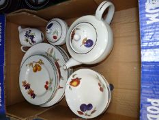 A Royal Worcester Evesham teapot, cream and sugar bowl, six dinner plates,
