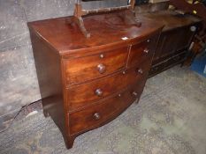 A Mahogany bow fronted Chest of two long and two short Drawers having turned knobs and standing on