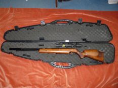 A Weihrauch air rifle with a hard case and telescopic sight. Believed .22 calibre.