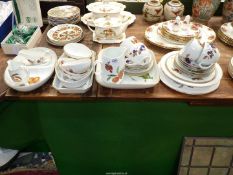 A quantity of Royal Worcester 'Evesham' china including cups and saucers, jugs, sauce boats,