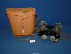 A pair of cased 12 x 50 field binoculars, case a/f.
