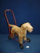 A small Push Along Dog made by Pedigree Soft Toys Ltd.