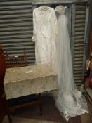 A 1960's ivory wedding dress and veil in Harrods box,