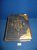 A Family Holy Bible, colour illustrated, leather bound and with brass corners and clasps,