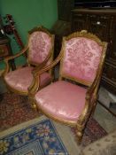 A fine pair of carved giltwood fauteuilles having turned and fluted tapering legs,