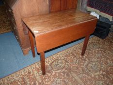 A circa 1900 Mahogany drop leaf table of Pembroke style standing on square legs,