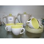 A Poole Pottery coffee set, grey outer/green inner, including six cups and saucers,
