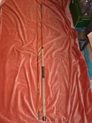 A Milbro unamed two piece 10' split cane spinning rod.