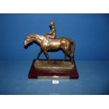 A horse racing trophy in the form of a horse and jockey with plaque engraved 'Winning Owner Acorn