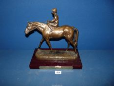 A horse racing trophy in the form of a horse and jockey with plaque engraved 'Winning Owner Acorn