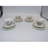 A set of four Royal Albert 'Wind in the Willows' teacups, saucers and plates.