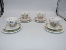A set of four Royal Albert 'Wind in the Willows' teacups, saucers and plates.