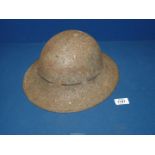 A WWII military metal helmet, dated 1941 to liner, BMB, size 6 3/4.