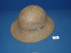 A WWII military metal helmet, dated 1941 to liner, BMB, size 6 3/4.