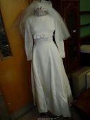A 1960's Wedding dress from Rackham's with veil, size small,