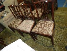 Three Georgian Mahogany side Chairs having fretworked splats and standing on square legs and with