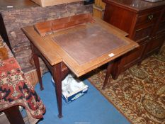 An unusual Satinwood side Table standing on tapering square legs and having a frieze drawer,
