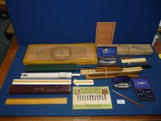 A quantity of early and mid 20th century architectural/surveying equipment including rulers and