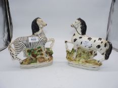 A very rare Staffordshire figure of a pony (some restoration) and another of a zebra, both c.