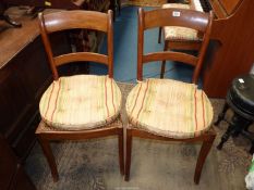A pair of cane seated bar back Side Chairs of mixed hardwood construction having swept front legs